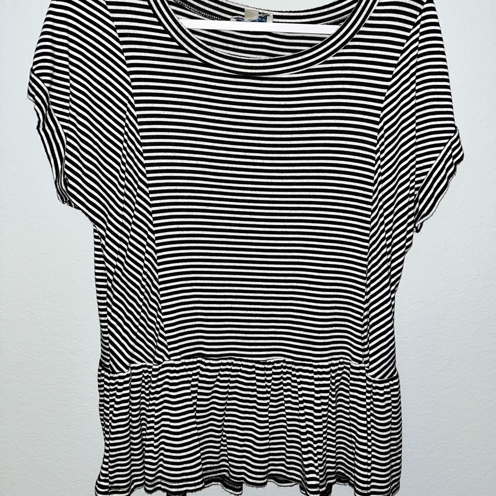 Staple yet basic black and white striped tshirt.